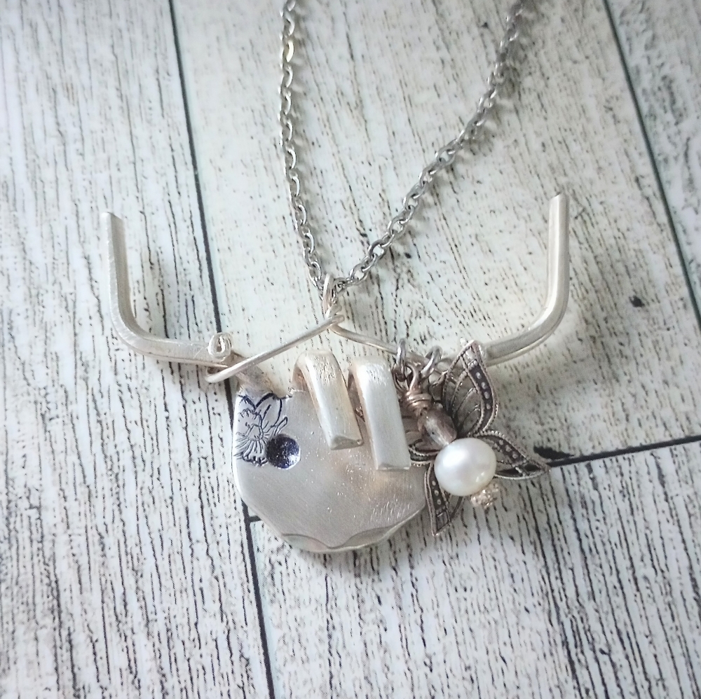 Cute highland cow made from a vintage silver fork